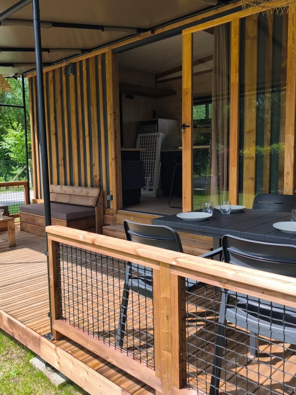Wooden terrace with garden furniture.